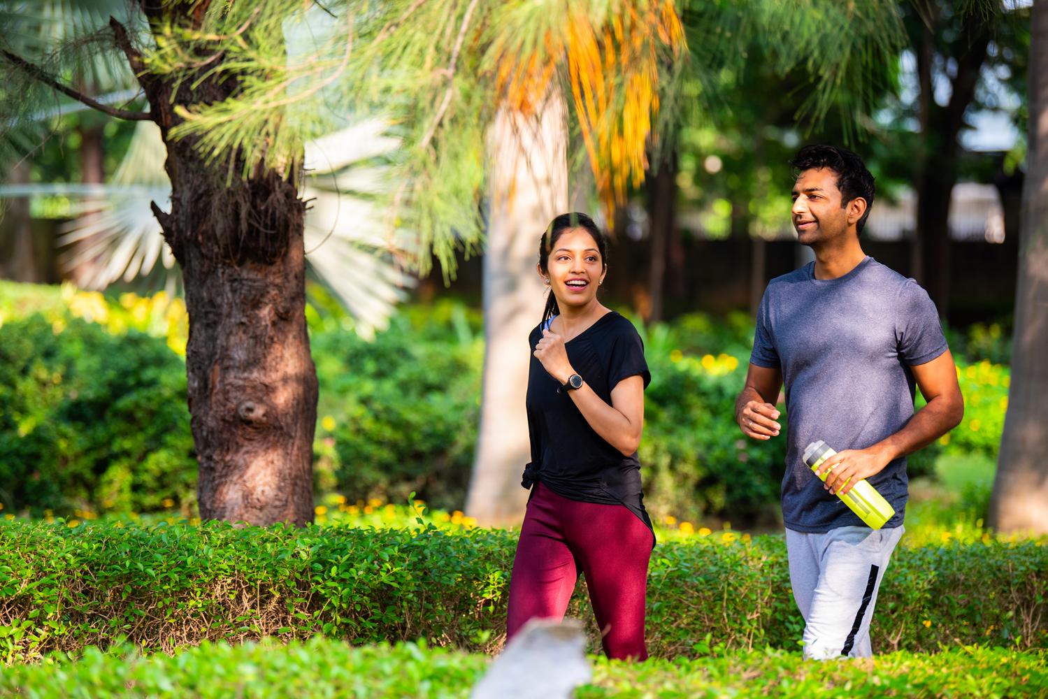 Couple walking in a park.