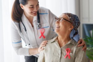 Patient and caregiver with pink ribbons
