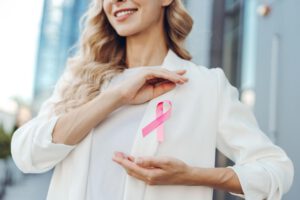 Woman wearing pink ribbon for awareness
