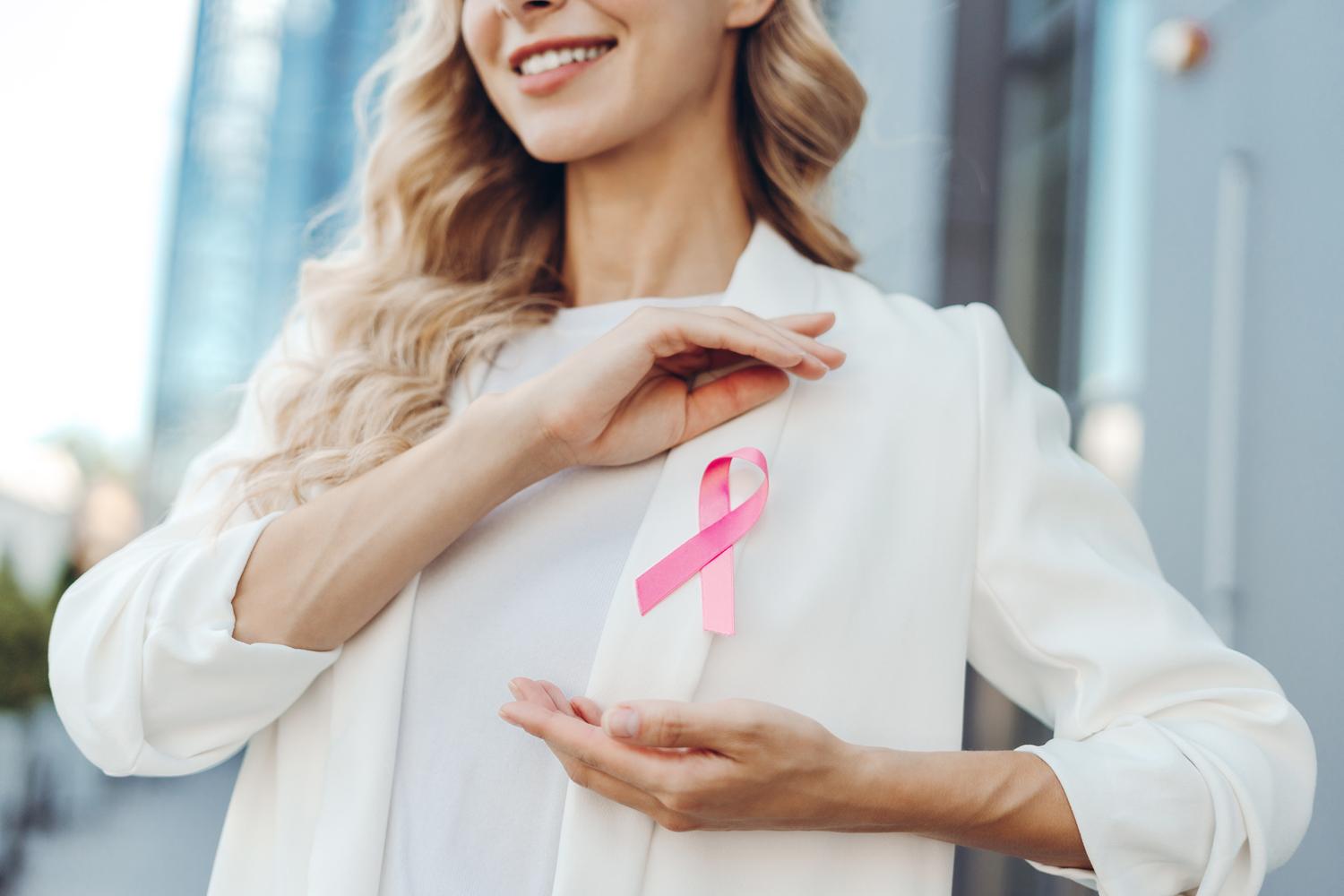 Woman wearing pink ribbon for awareness