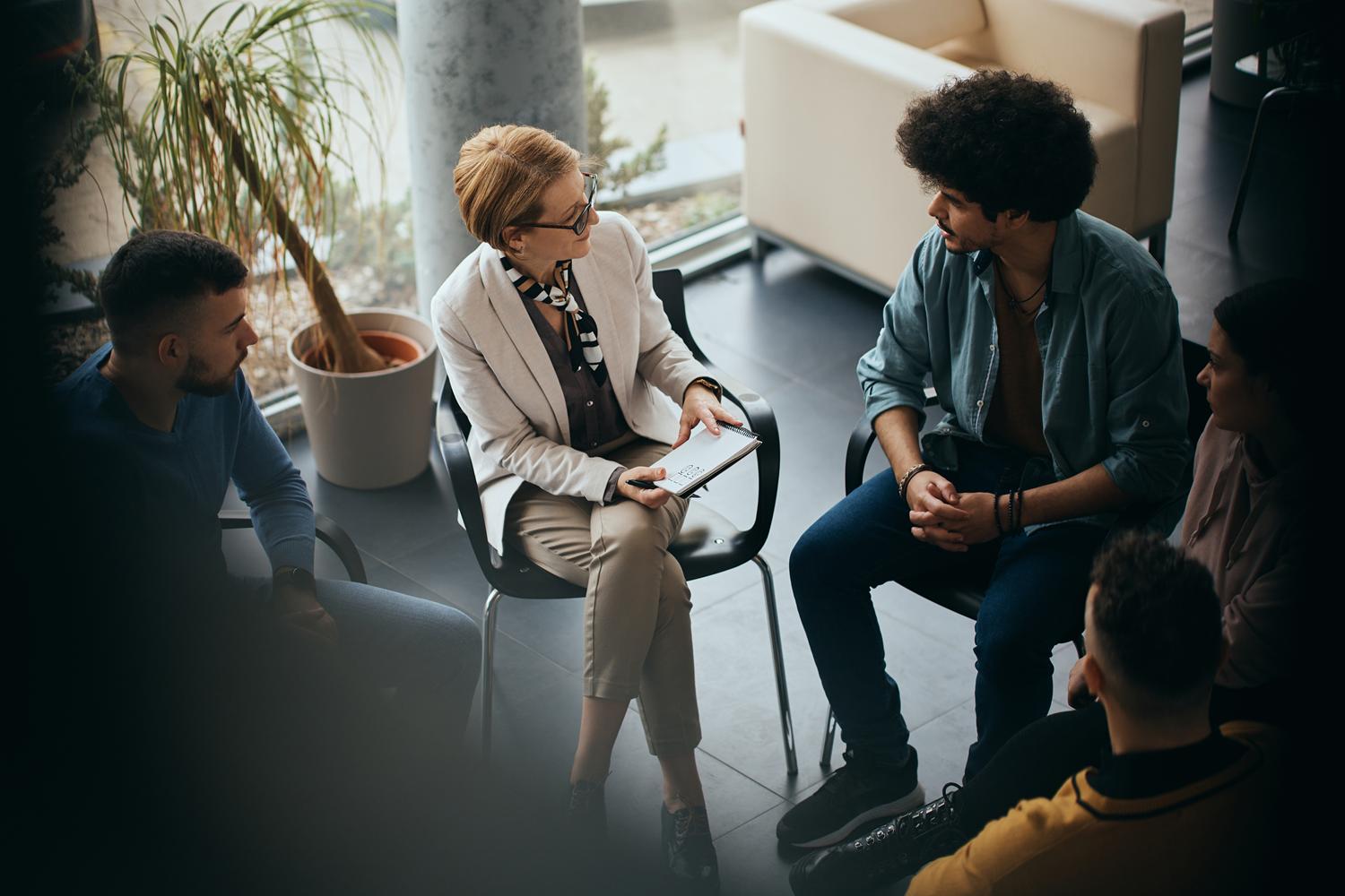 Group therapy session with a counselor