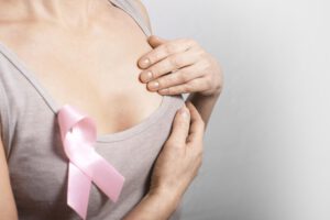 Woman with pink ribbon on shirt