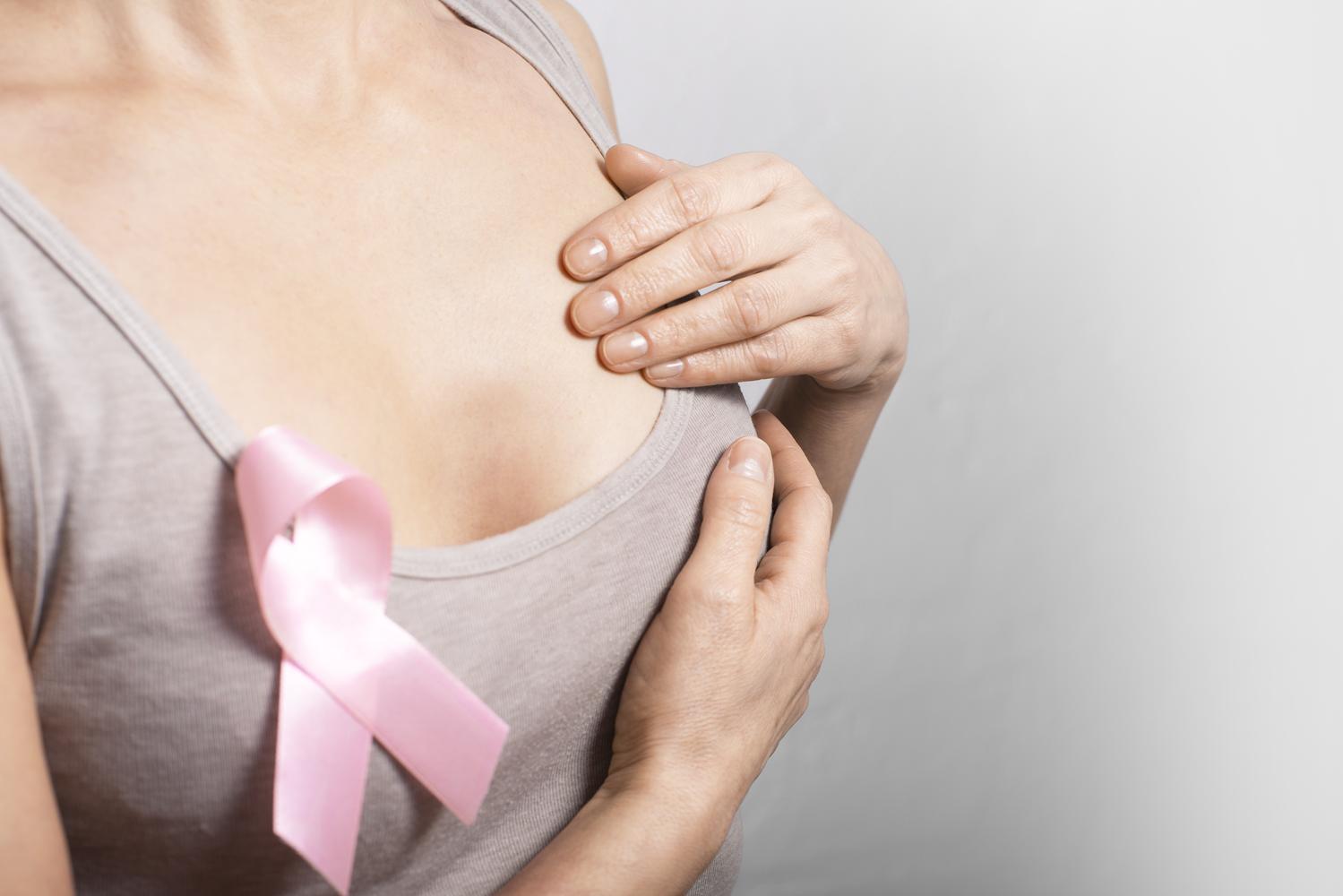 Woman with pink ribbon on shirt
